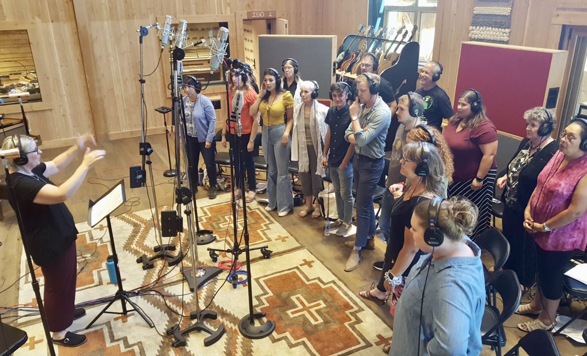 Director Mindy Wall ably leads the choir during the recording session.