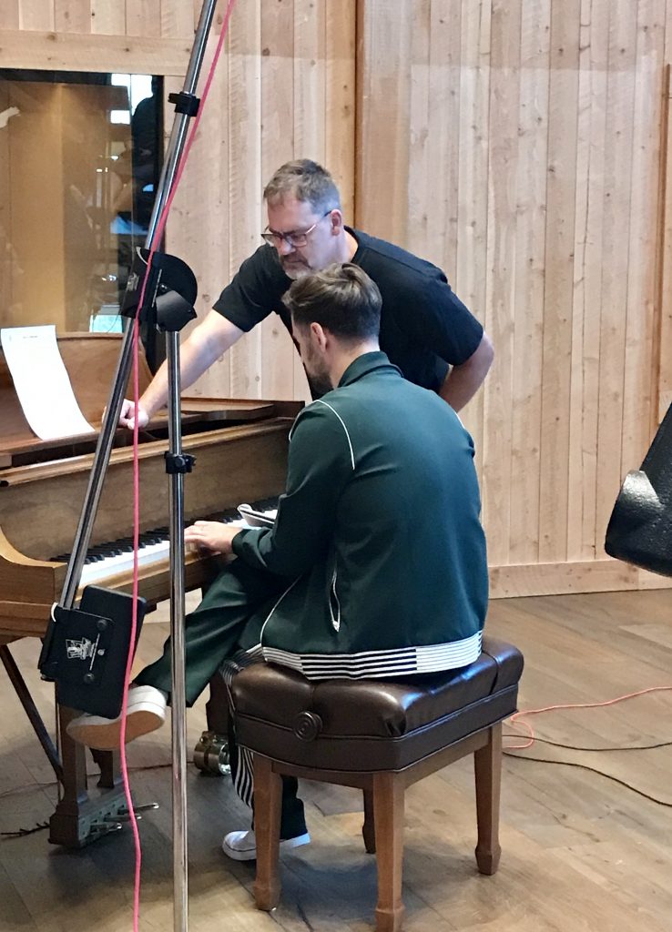 Ryan Lewis at the piano with LVV member Darryl Wall.